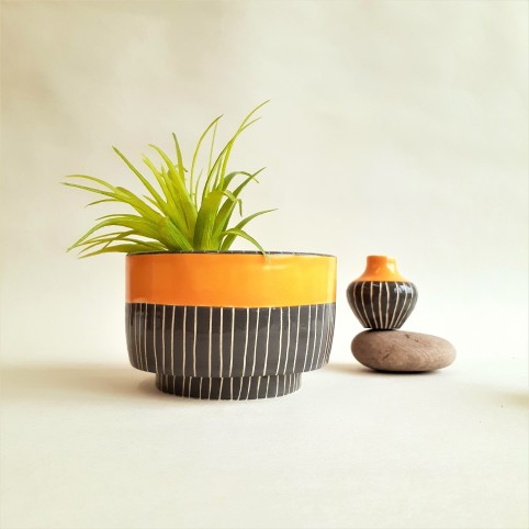 Footed planter with tiny vase